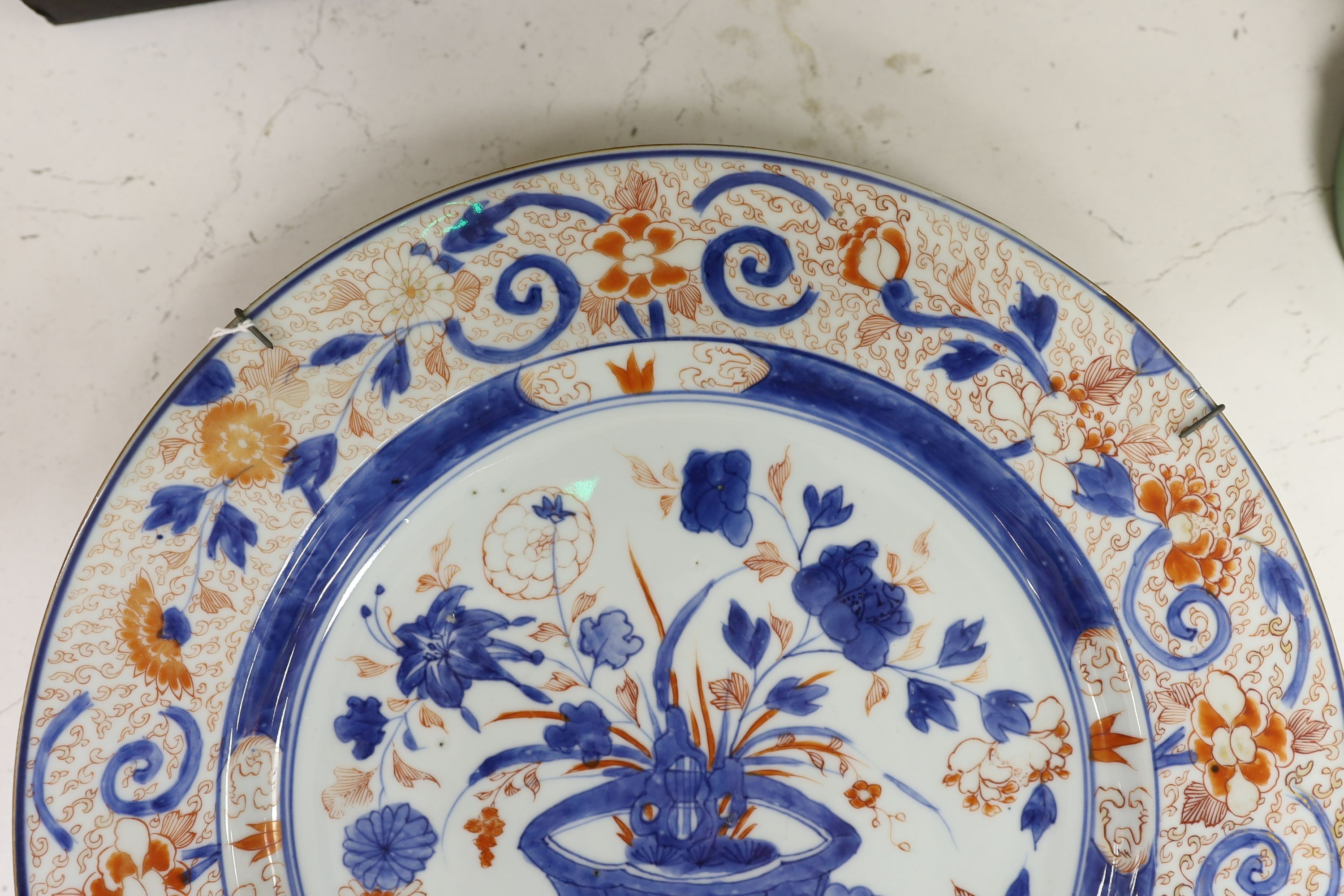 A pair of Chinese Imari dishes, Kangxi period, on wooden stands, 31 cms diameter., Provenance - D.C.Monk & Son, former dealers based in Kensington Church Street, London W8